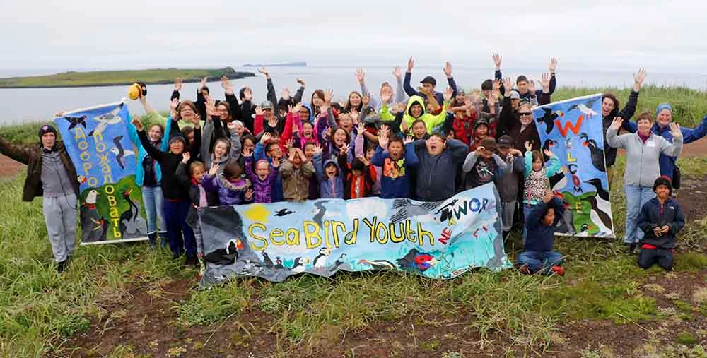 Joint Seabird Camp 2-17_Ram Papish_web A group of kids with banners for the Seabird Youth Network
