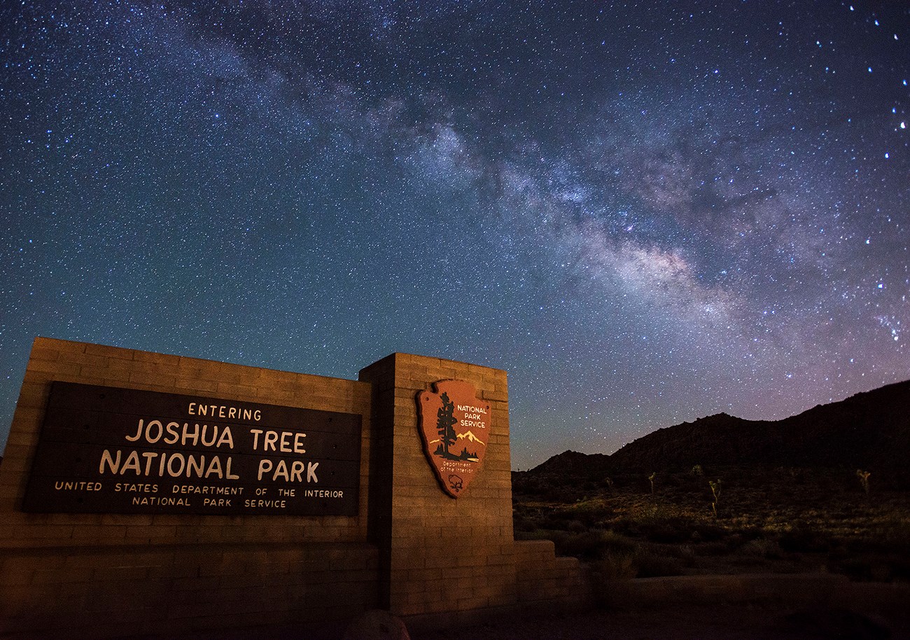 Joshua Tree National Park entrance sign with Milky Way
