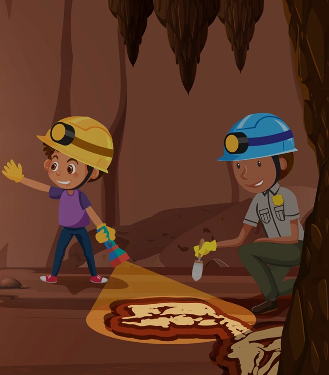 a child and a ranger examine a fossil in a cave