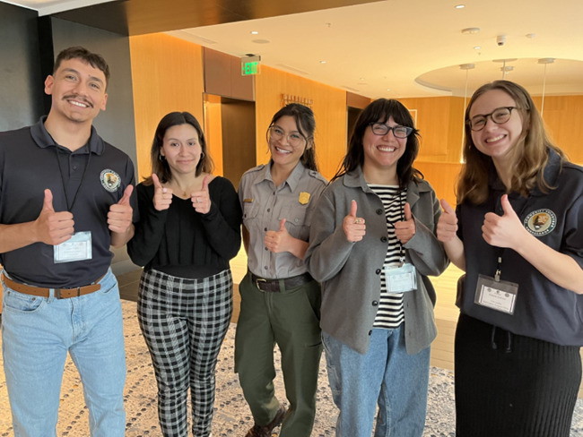 Juan Pablo stands with group of NPS staff and interns at CVA National Early Service Training