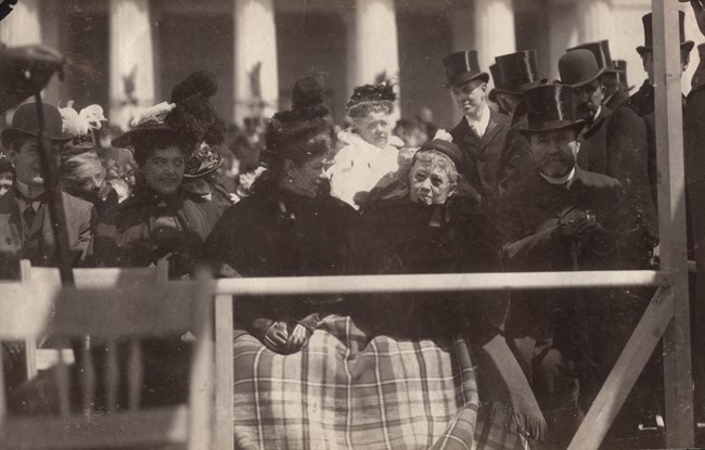 Julia Dent Grant at Ulysses S. Grant Tomb Dedication Ceremony Black and white photo of two women with hats and a blanket covering their laps while sitting among a crowd