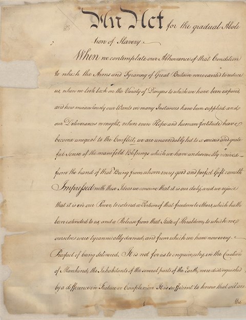 The Pennsylvania Gradual Emancipation Act of 1780. A faded yellow document with black hand written text of the Pennsylvania Gradual Emancipation Act.