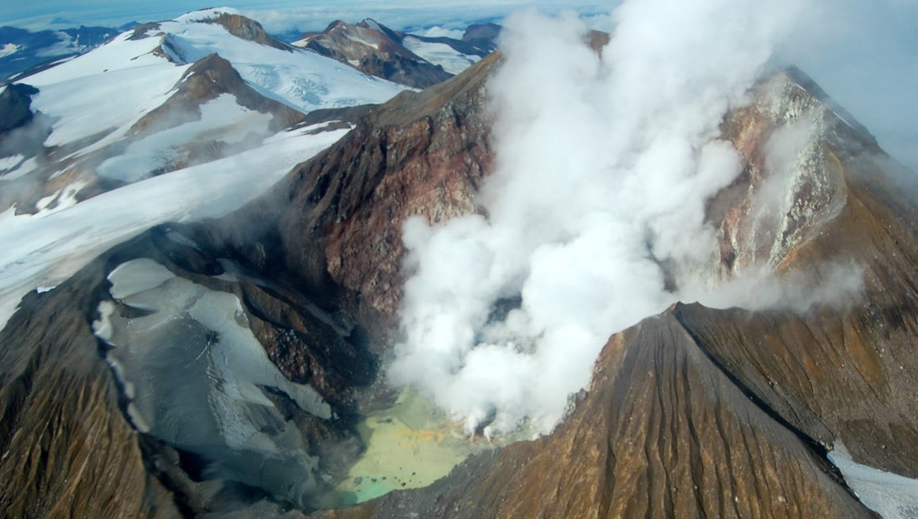 volcanic summit crater with steaming fumaroles