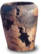 A cracked ceramic vessel with a tapered based and narrowing mouth
