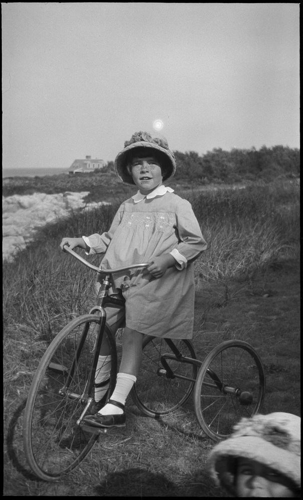Rosemary on a tricycle at beach