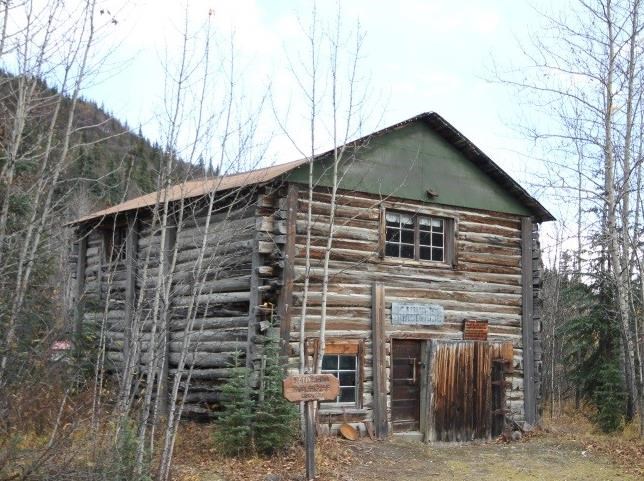 Color photograph of the Kantishna Roadhouse in its present day condition in 2018. Photo is taken looking southeast.