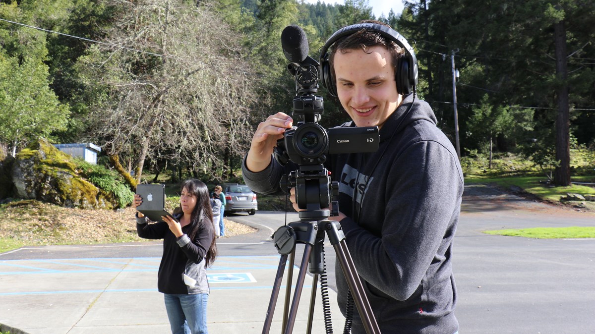 Karuk Tribe K-12 Curriculum Oral History Documentation Luis from the Karuk Tribe with a camera