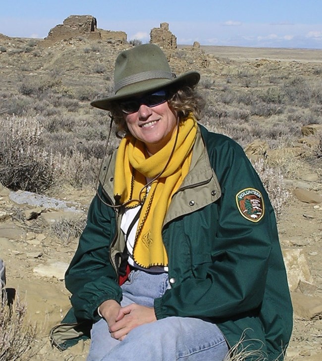 Kelley Hays-Gilpin at Chaco Photo of a woman in a desert landscape