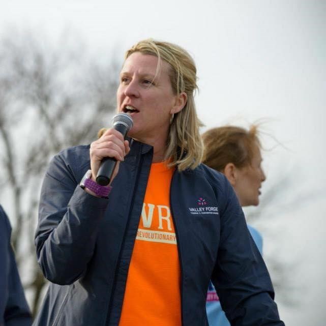 A person speaks into a microphone