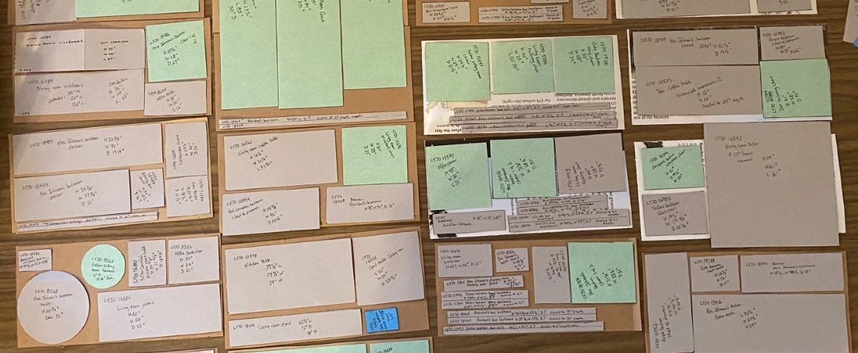Paper notes in a variety of shapes and sizes are laid out to fit together as if like a puzzle.