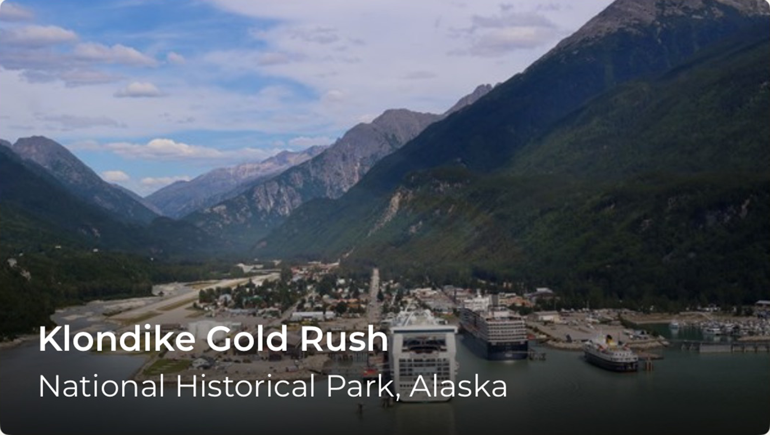Mountains in the background and buildings in the foreground.