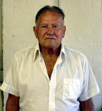 a man in a white button up shirt