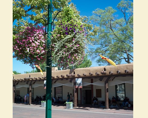 The Palace of the Governors, home to three centuries of Santa Fe’s political and military leaders, stretches along the plaza’s north side. Photo © Jack Parsons