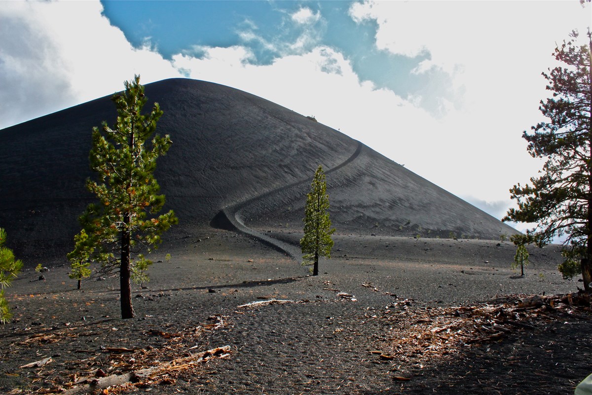 cinder cone with trail and few trees