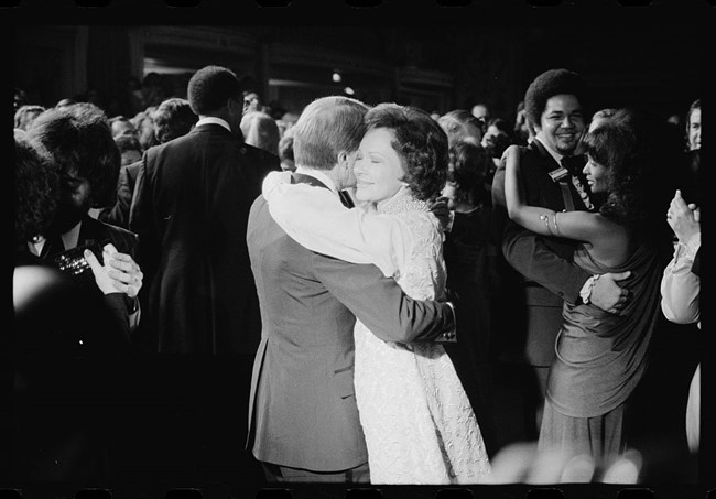 Carter Inaugural Ball, Library of Congress 2005696400 President Jimmy Carter and First Lady Rosalynn Carter dance smiling at an inaugural ball on a crowded dance floor.