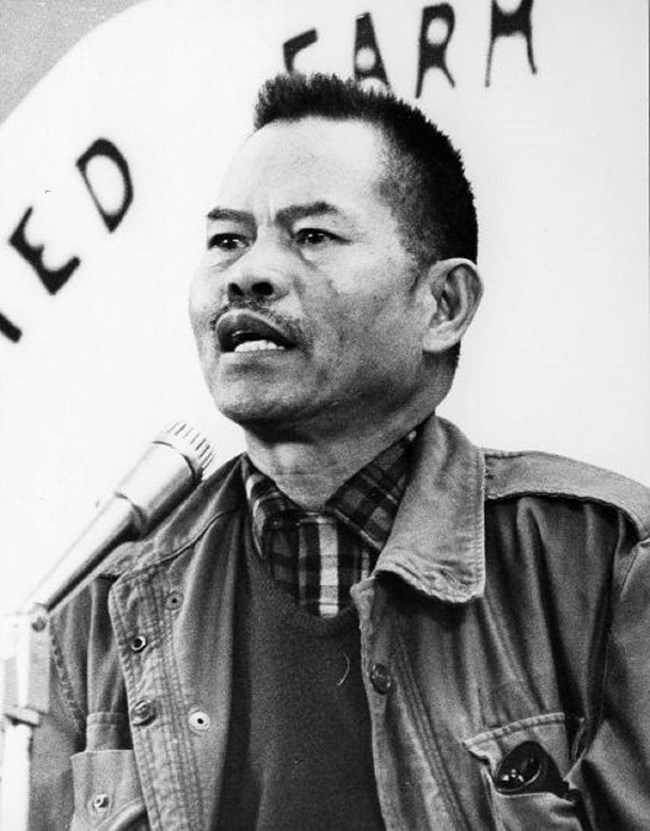 Larry Itliong, a leader of AWOC and the UFW, speaks at an event.