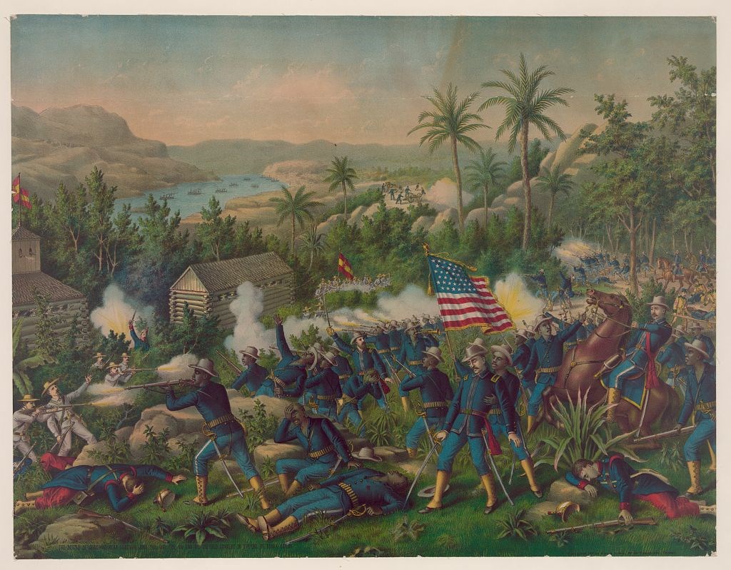 The Battle of Guasimas near Santiago June 24th, 1898. Illustration of African American and white men wearing blue uniforms, yellow stockings, and gray hats fighting white men in gray uniforms and yellow hats. The fighting takes place on a hill filled with tall trees overlooking a lake