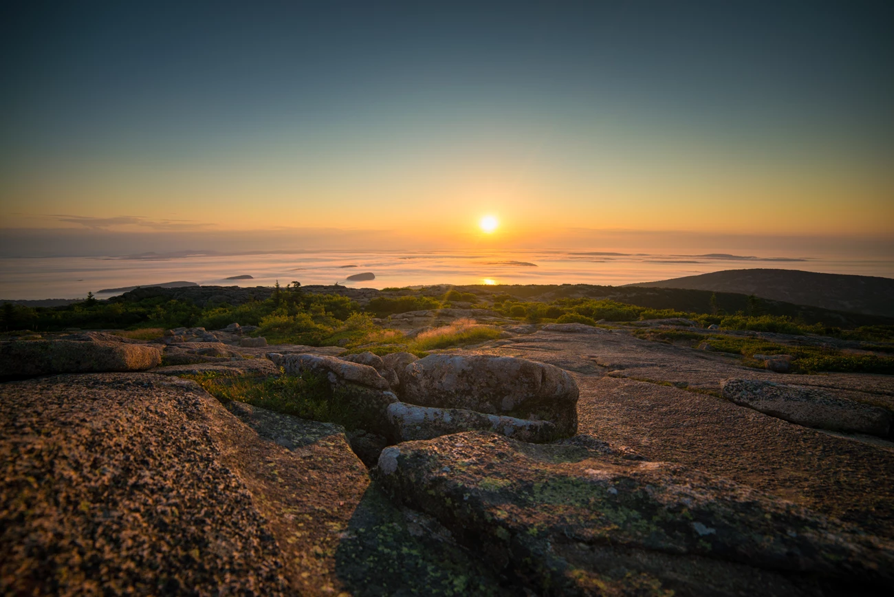 Cadillac Mountain Sunrise and fog from a rocky summit
