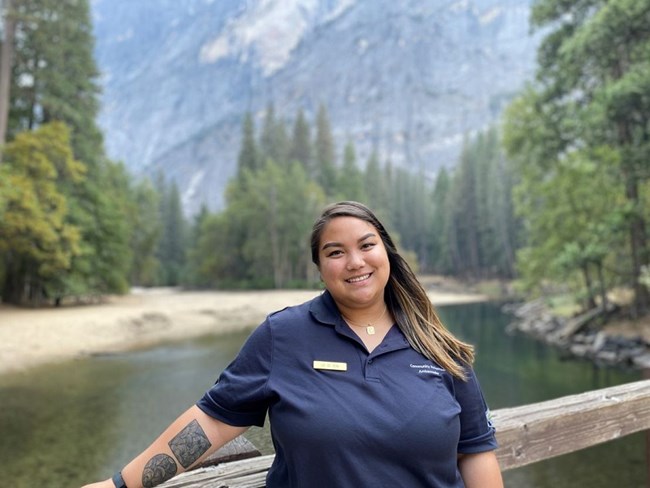 Lei De Vera Lei smiling posing for a picture with lake and mountains in the back