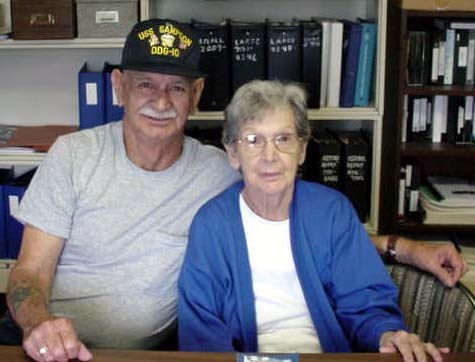 Leo and Rita sit, smiling