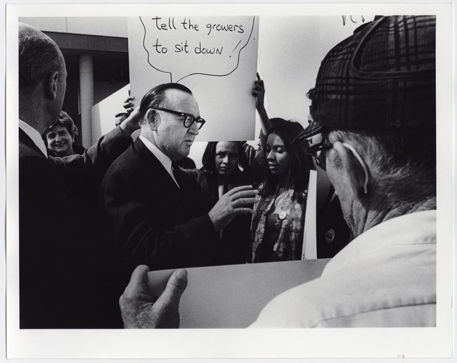 Volunteers and Picketing Governor Edmund Gerald "Pat" Brown, Sr. in Bakersfield, California. Picketers and volunteers address Governor Edmund Gerald "Pat" Brown, Sr. in Bakersfield, California.