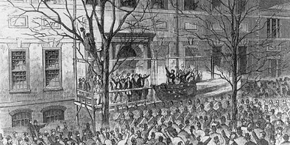 Black and white illustration showing a crowd of people facing a platform where a man raises a flag.