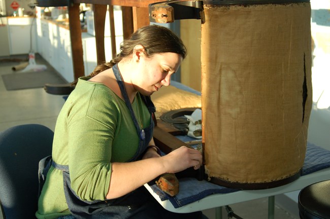 Liz Peirce cleaning the Wightman Couch. Liz Peirce cleaning the Wightman Couch.