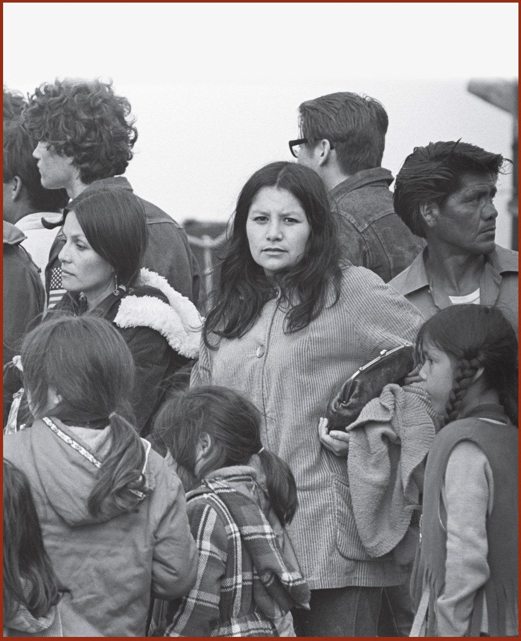 Woman and children among crowd going to Alcatraz, 1970