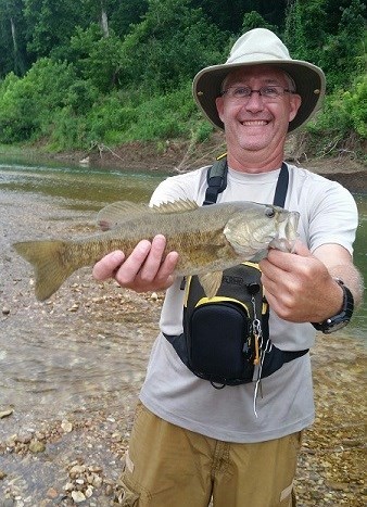 Angler with smallmouth bass