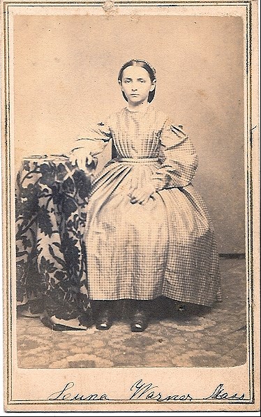 Luna Warner 1870s photo of 15 year old girl with dark pulled back hair in long dress sits for portrait