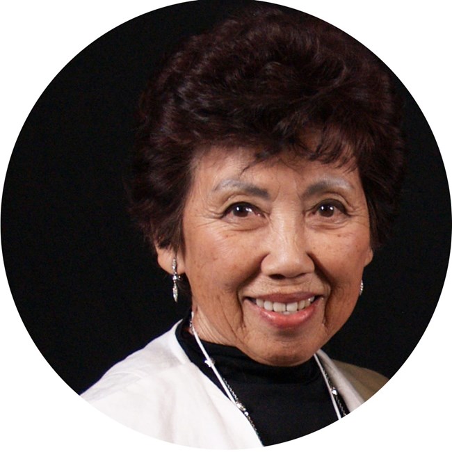 Japanese American woman smiles at camera