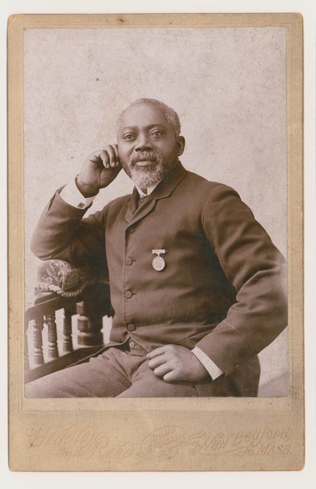 MHS-3848_carney_work_lg Civil War Veteran William Carney, an African American man in a suit with a medal.