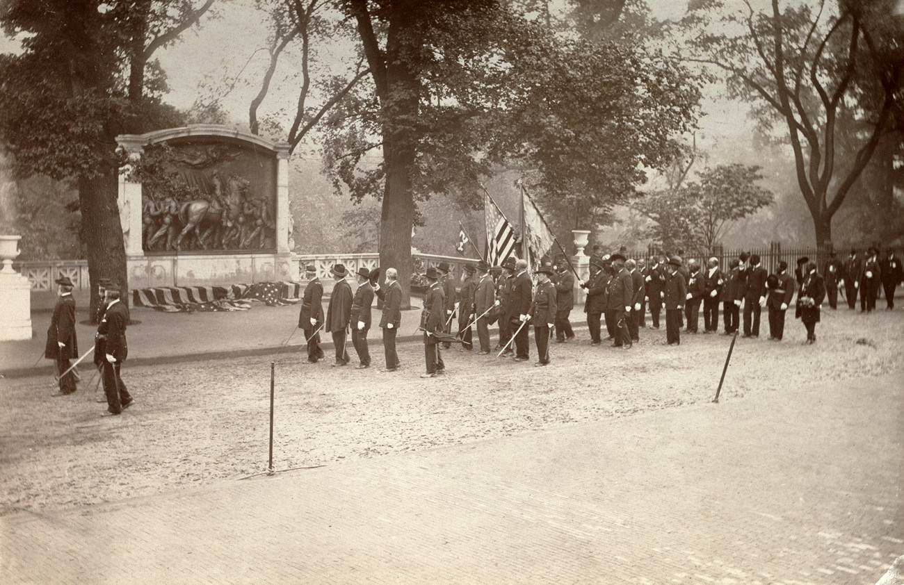 MHS BAL_197915 Veterans of the Massachusetts 54th Regiment standing in formation in front of the Shaw 54th Massachusetts Regiment Memorial.