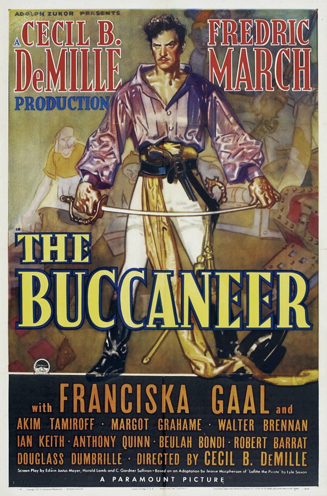 The Buccaneer 1938 A 1938 movie poster with the title and the character "Jean Lafitte" standing in the center.