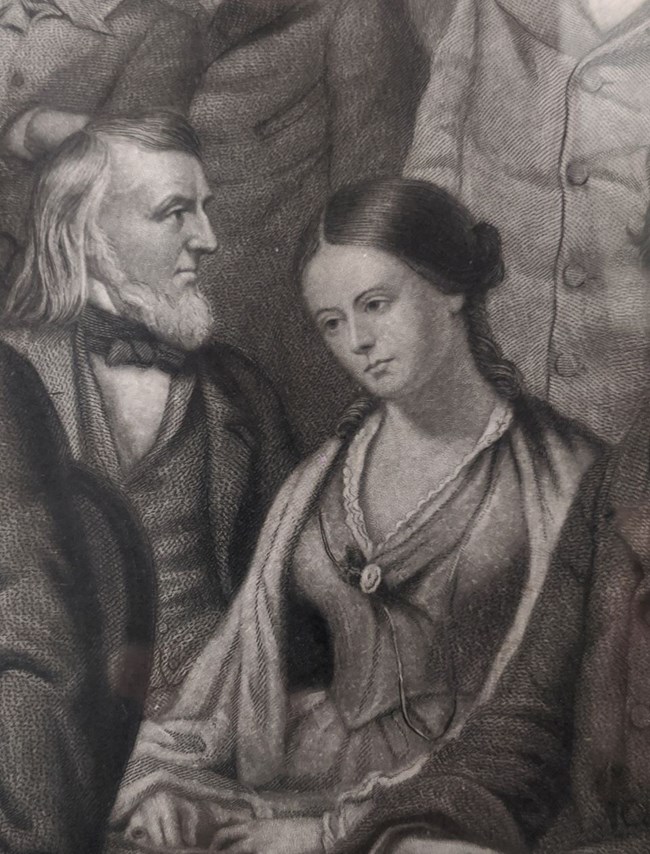 Detail of group portrait engraving showing woman looking down seated next to man looking in profile right