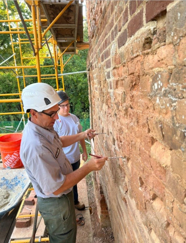 HPTC Masonry and Skillbridge participant perform structural repair work at Want Water Ruins near Harmony Hall