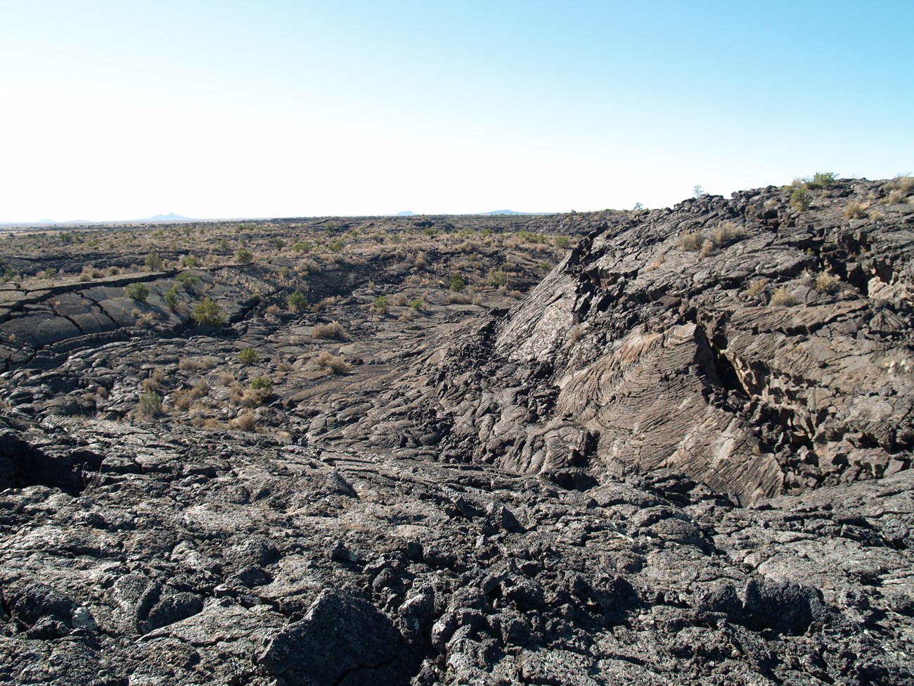 McCart_inflation_margin photo of barren rocky land surface with slight depression