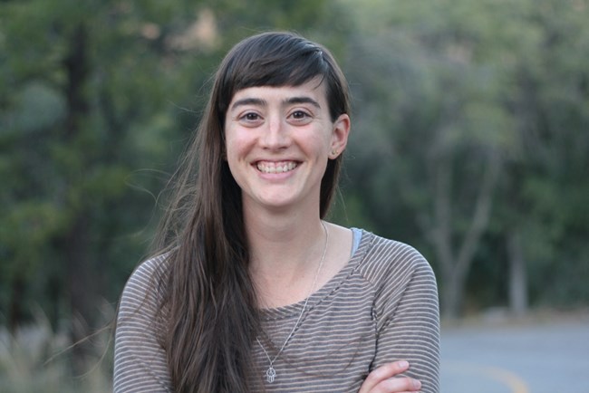 A woman with long brown hair.