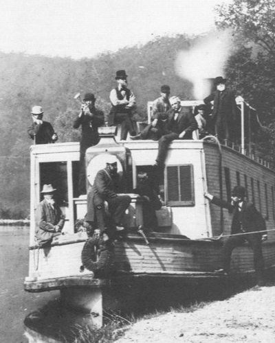Historical image of men boarding a canal boat.