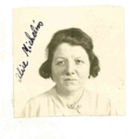 A photograph of Alice Michelin in 1943.  She is wearing a white shirt and is shown in front of an off-white background.  She has short dark hair.