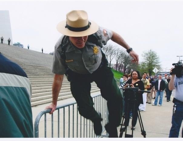 Horton 1 A park ranger jumps over a metal barricade