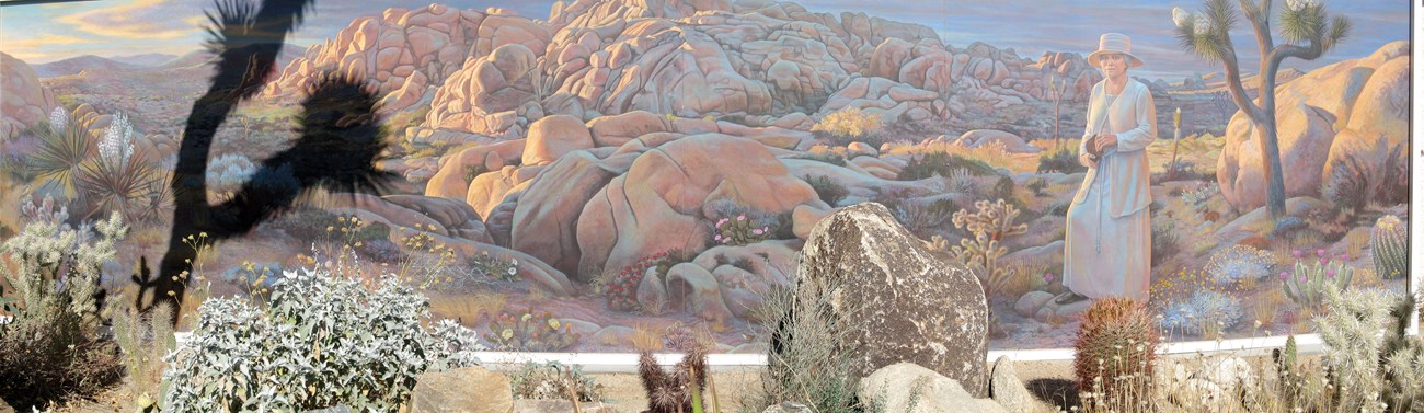 Mural depicting Minerva Hamilton Hoyt against the backdrop of Joshua Tree National Park