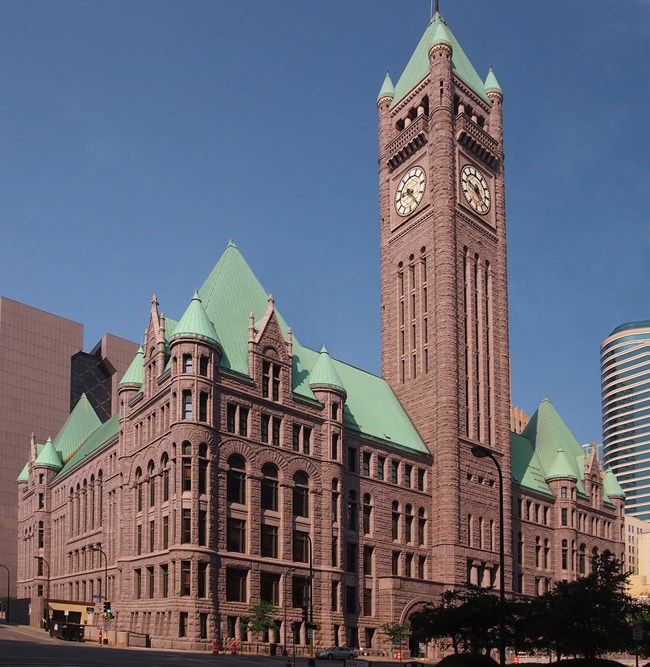 Large stone courthouse with spires.