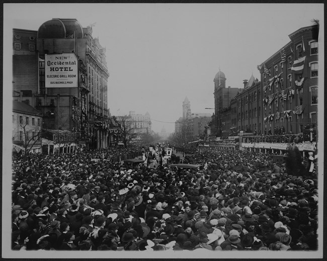 photo of a crowd blocking in a parade