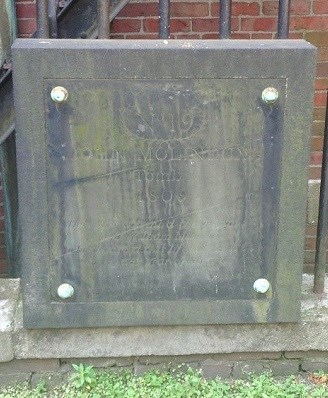 stone square gravestone with "Molineux" lightly engraved