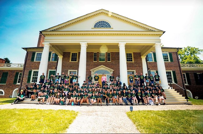NHA Academy Students A large group of children sit in front of Monticello