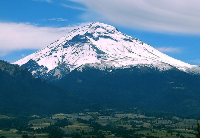 Mount Popocatepetl large mountain covered with snow.