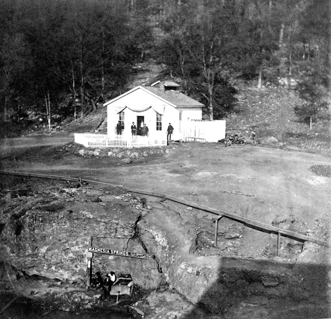 Barn's Mud Hole Bathhouse on the side of a mountain