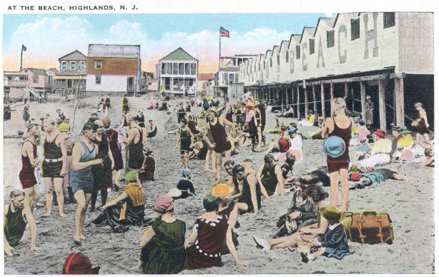 visitors in bathing suits line the beach