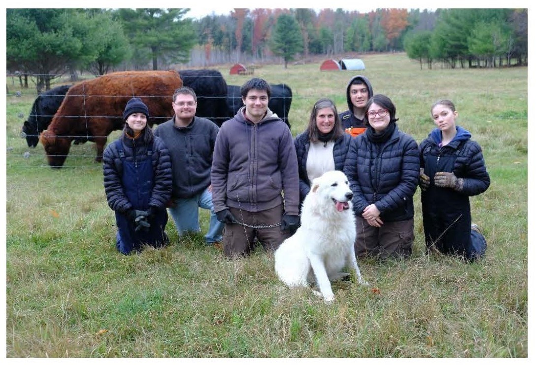 Family Photos with a dog and a few cows.